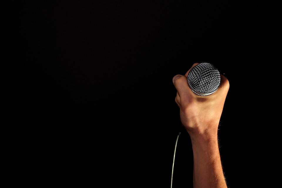 holding a microphone
